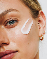 model applying Ceramide Skin Rescue Moisture Barrier Balm