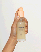 model holding PEACH & GLOW Hydra Skin Tonic