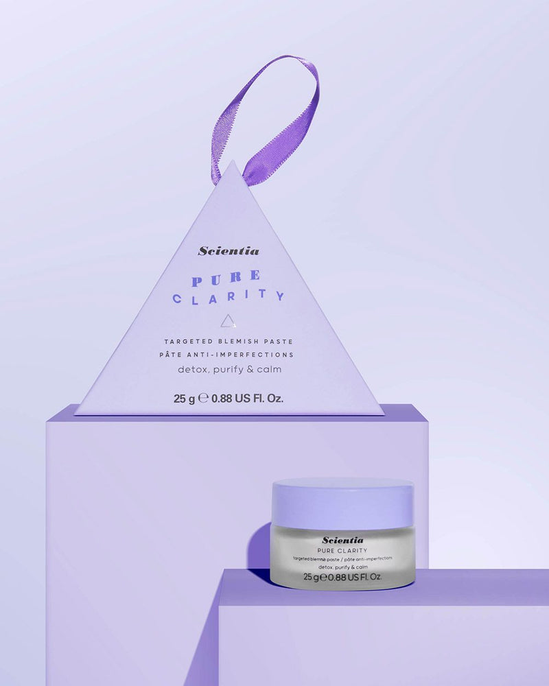 BLEMISH PASTE PYRAMID Pure Clarity Targeted Blemish Paste Bauble on a purple setting